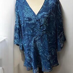 Ice Blue Silk Ruffled Blouse with V-Neckline and Bell Sleeves